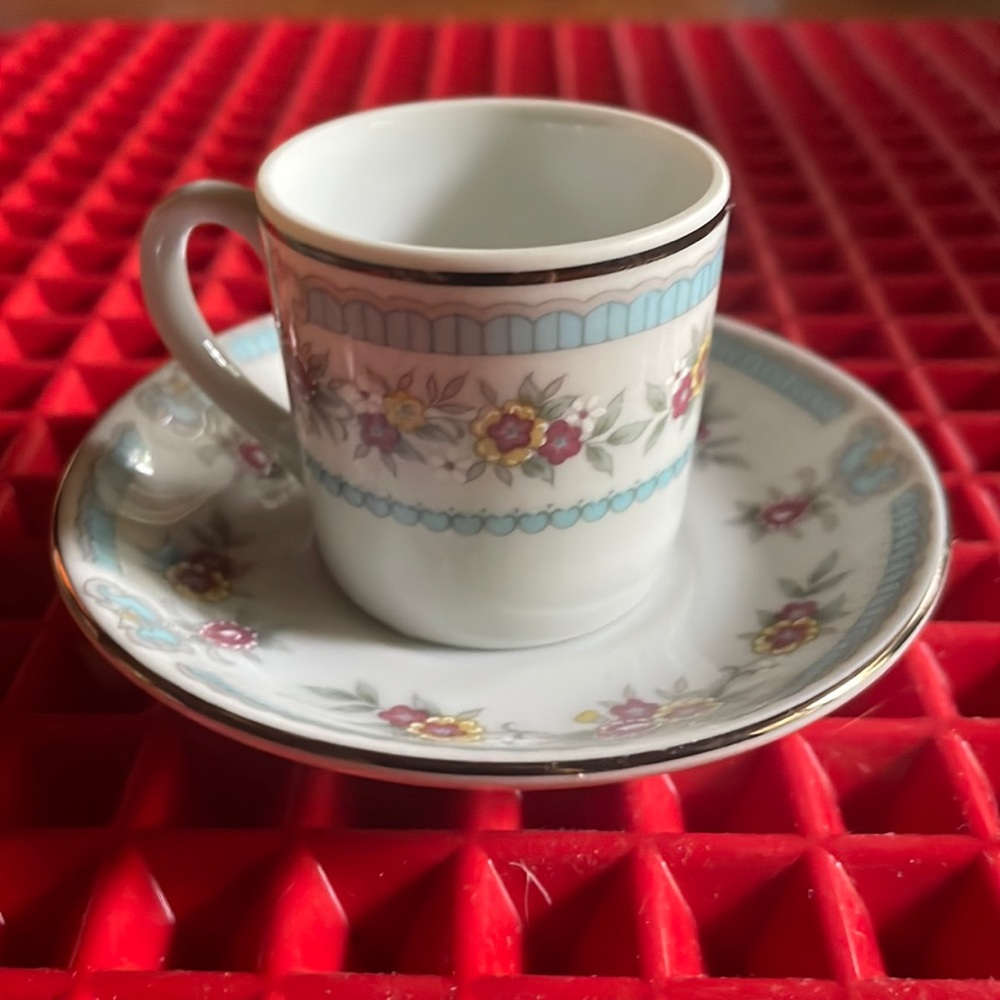 A LEART MINERATURE FLORAL TEACUP AND SAUCER